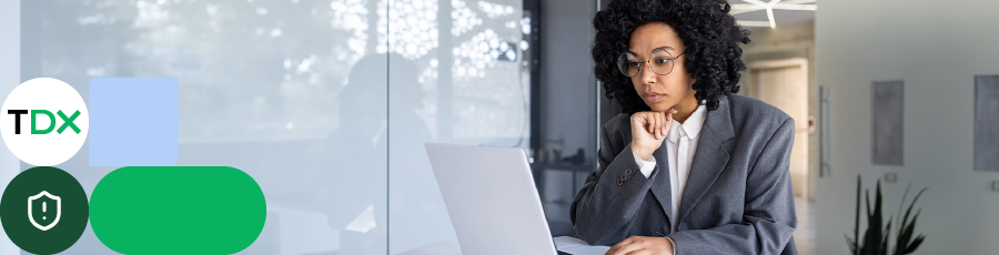 in the work space looking into her screen and Getting Started With Cybersecurity Certifications