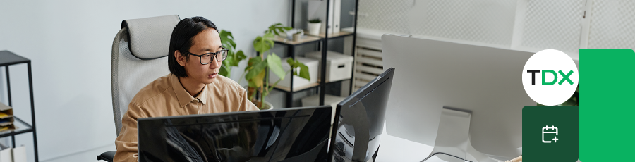 Person sitting at a multi-monitor setup, representing CEH (Certified Ethical Hacker).